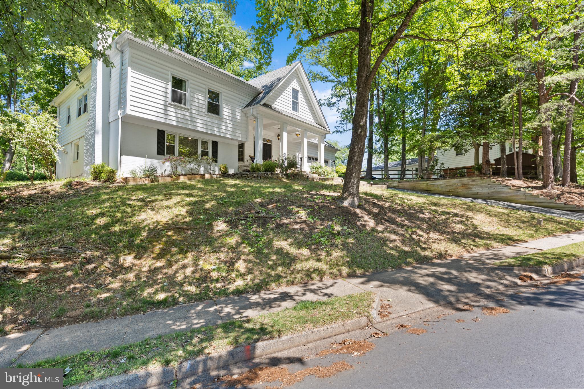 11019 Ring Road Reston, VA 20190 - Photo 2 of 78 a front view of a house with a garden
