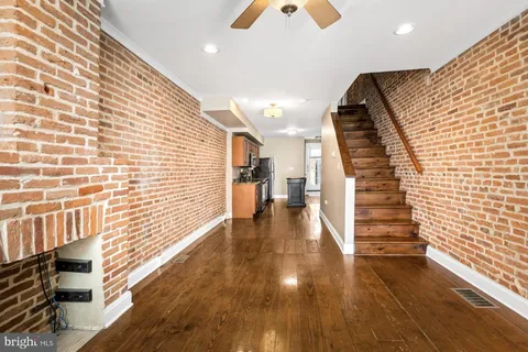a view of entryway with wooden floor
