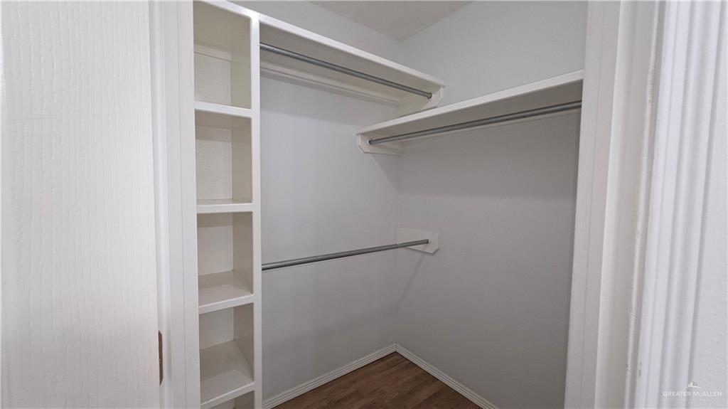 2014 Northgate Circle Weslaco, TX 78599 - Photo 18 of 23 Spacious closet featuring dark wood-type flooring