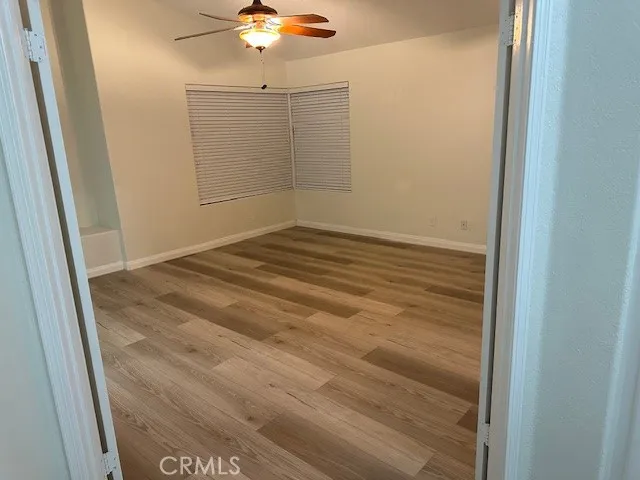 a living room with stainless steel appliances kitchen island furniture and a fireplace
