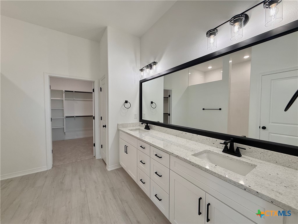 2016 Yarrow Road Temple, TX 76502 - Photo 23 of 30 a spacious bathroom with a double vanity sink and mirror