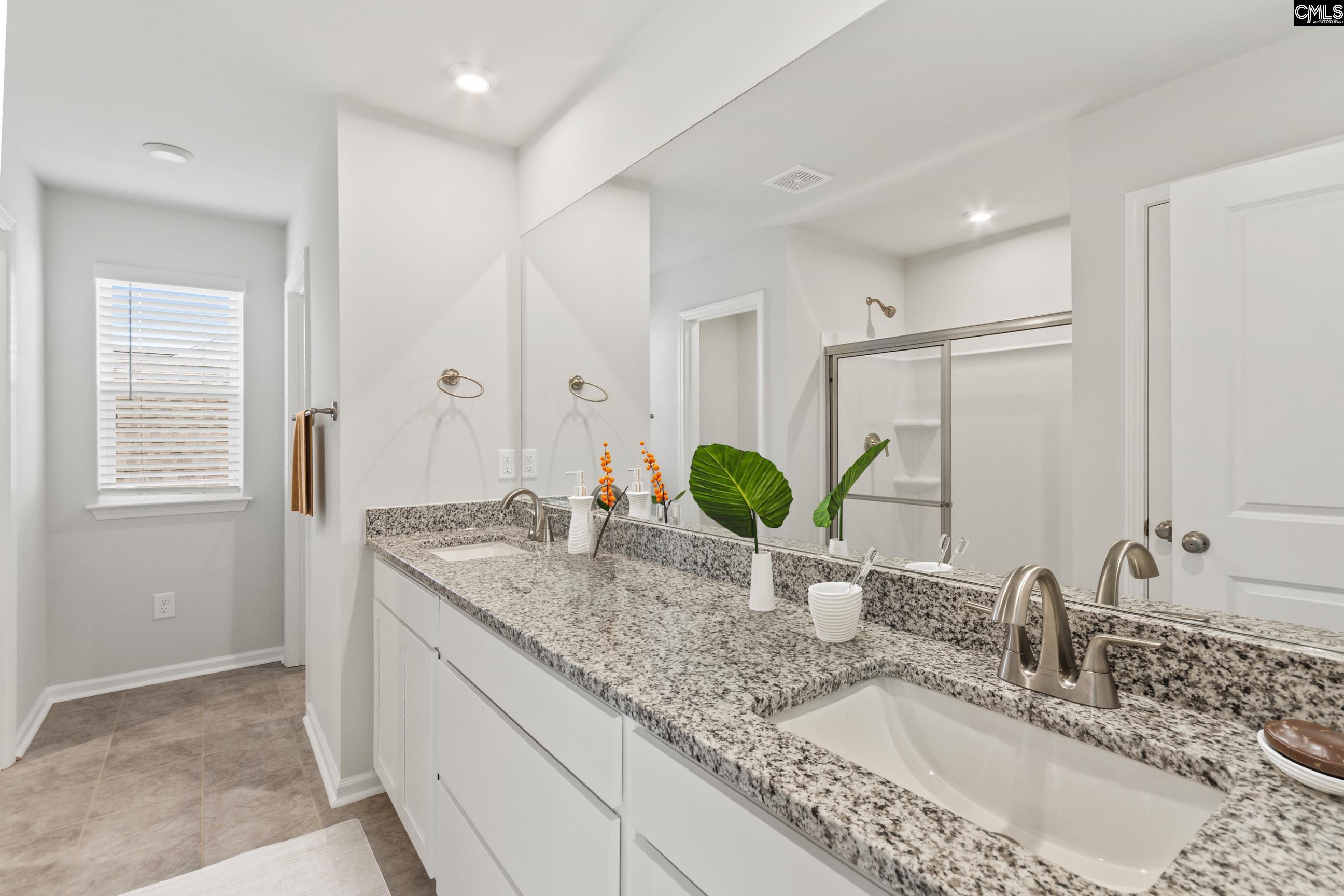 320 Brass Billion Path Lexington, SC 29073 - Photo 37 of 39 a bathroom with a granite countertop sink and a mirror