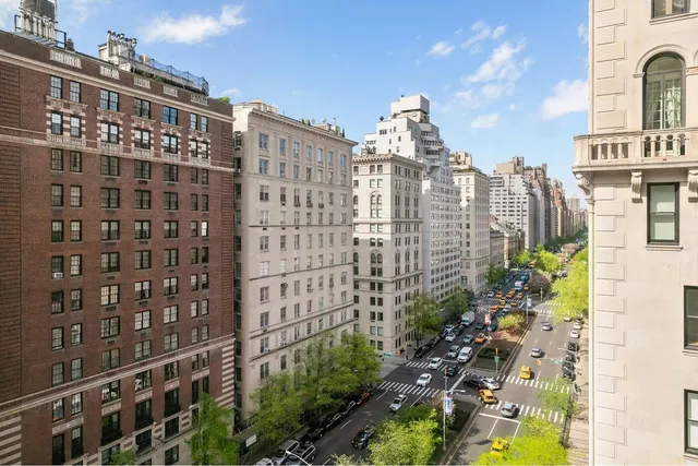 a view of a living room and balcony with furniture
