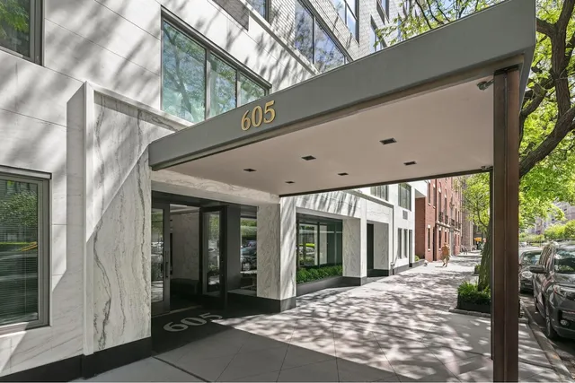 a kitchen with stainless steel appliances kitchen island a stove and a shower