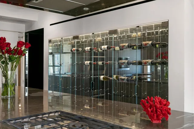 a kitchen with stainless steel appliances granite countertop a sink and a refrigerator