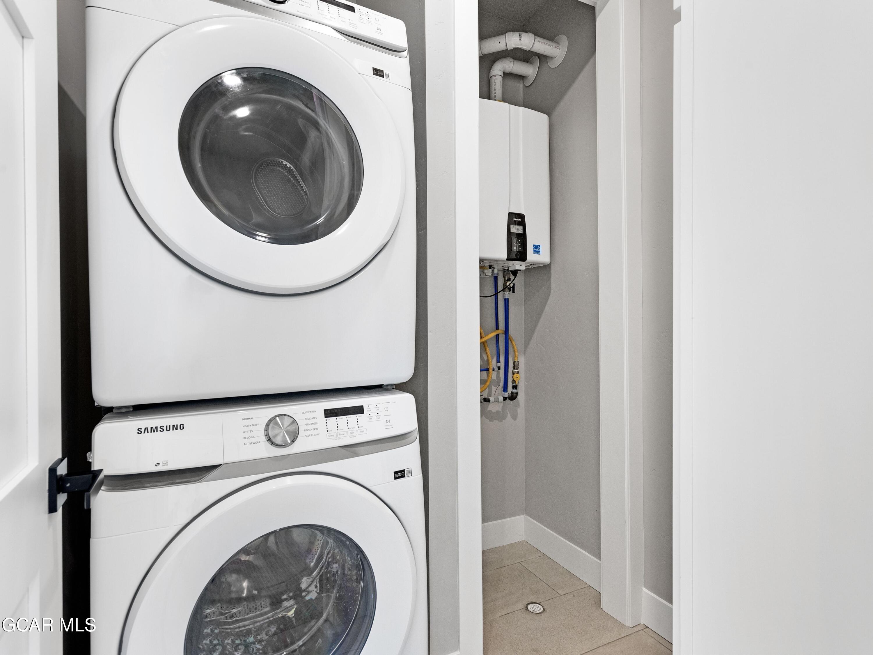 60 Ski Idlewild Road Winter Park, CO 80482 - Photo 23 of 46 a utility room with dryer and washer
