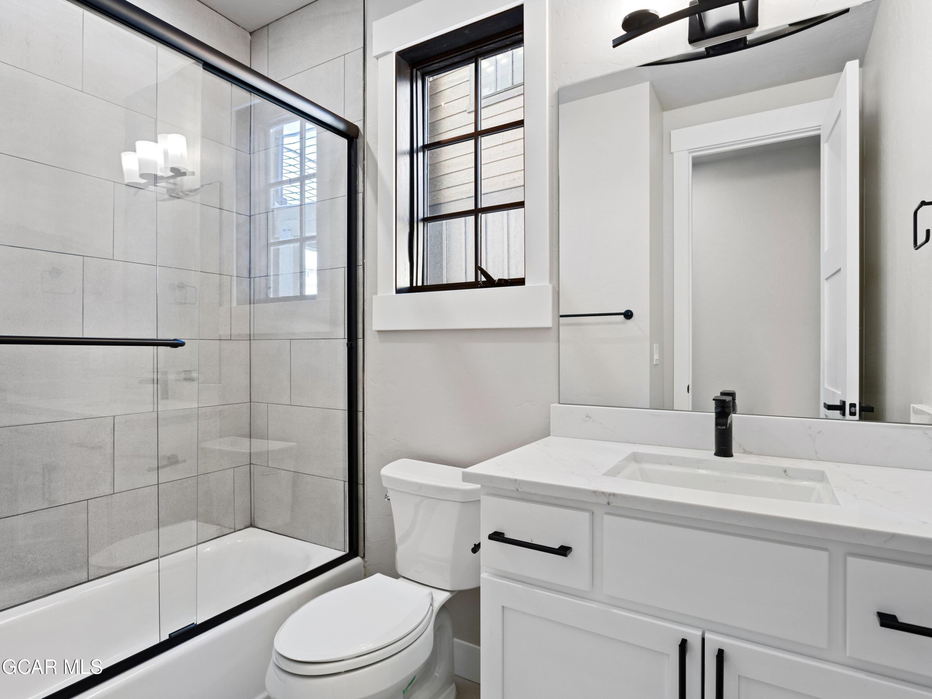 60 Ski Idlewild Road Winter Park, CO 80482 - Photo 37 of 46 a bathroom with a sink a toilet and shower