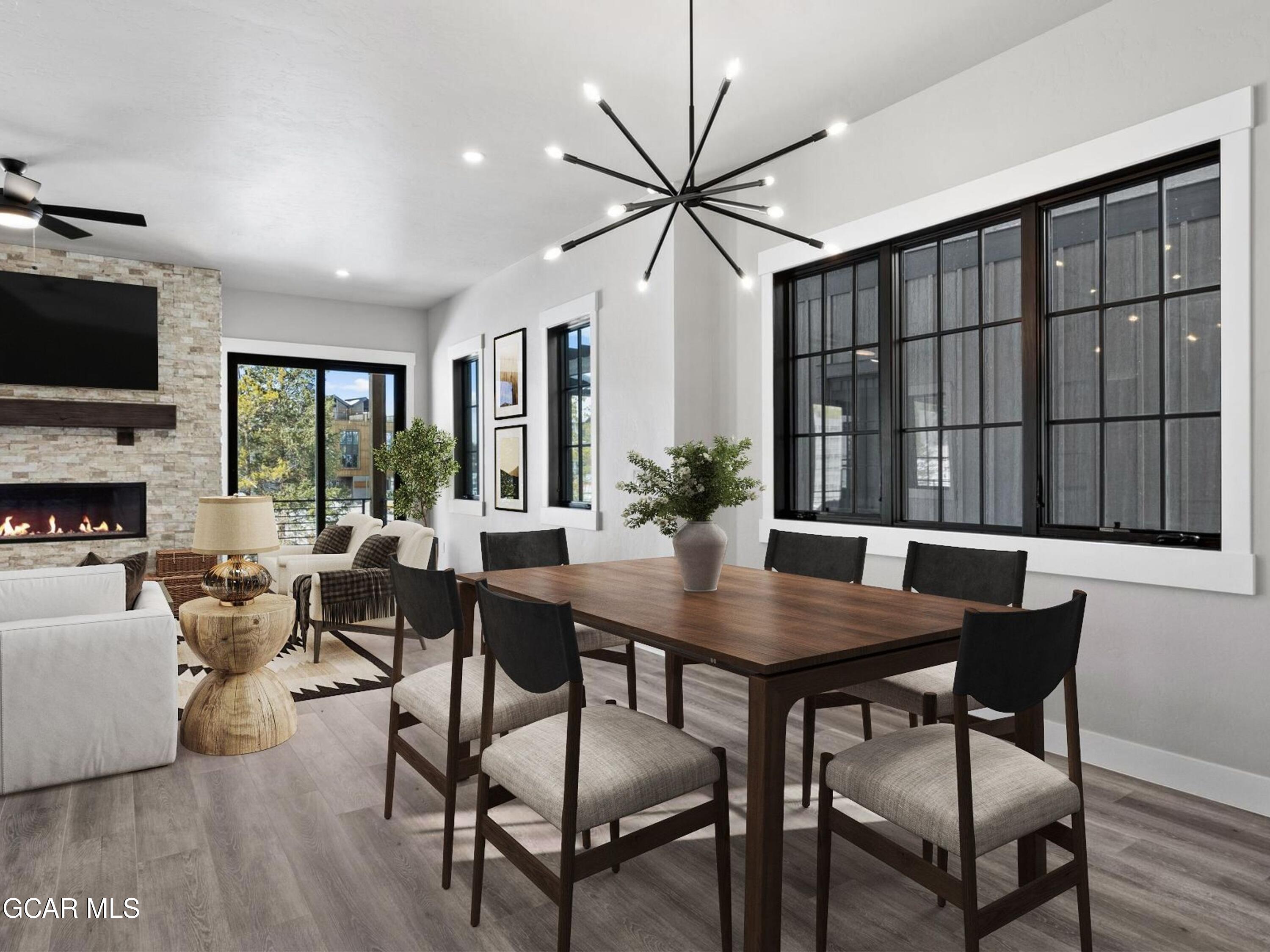60 Ski Idlewild Road Winter Park, CO 80482 - Photo 8 of 46 a view of a dining room with furniture window and wooden floor