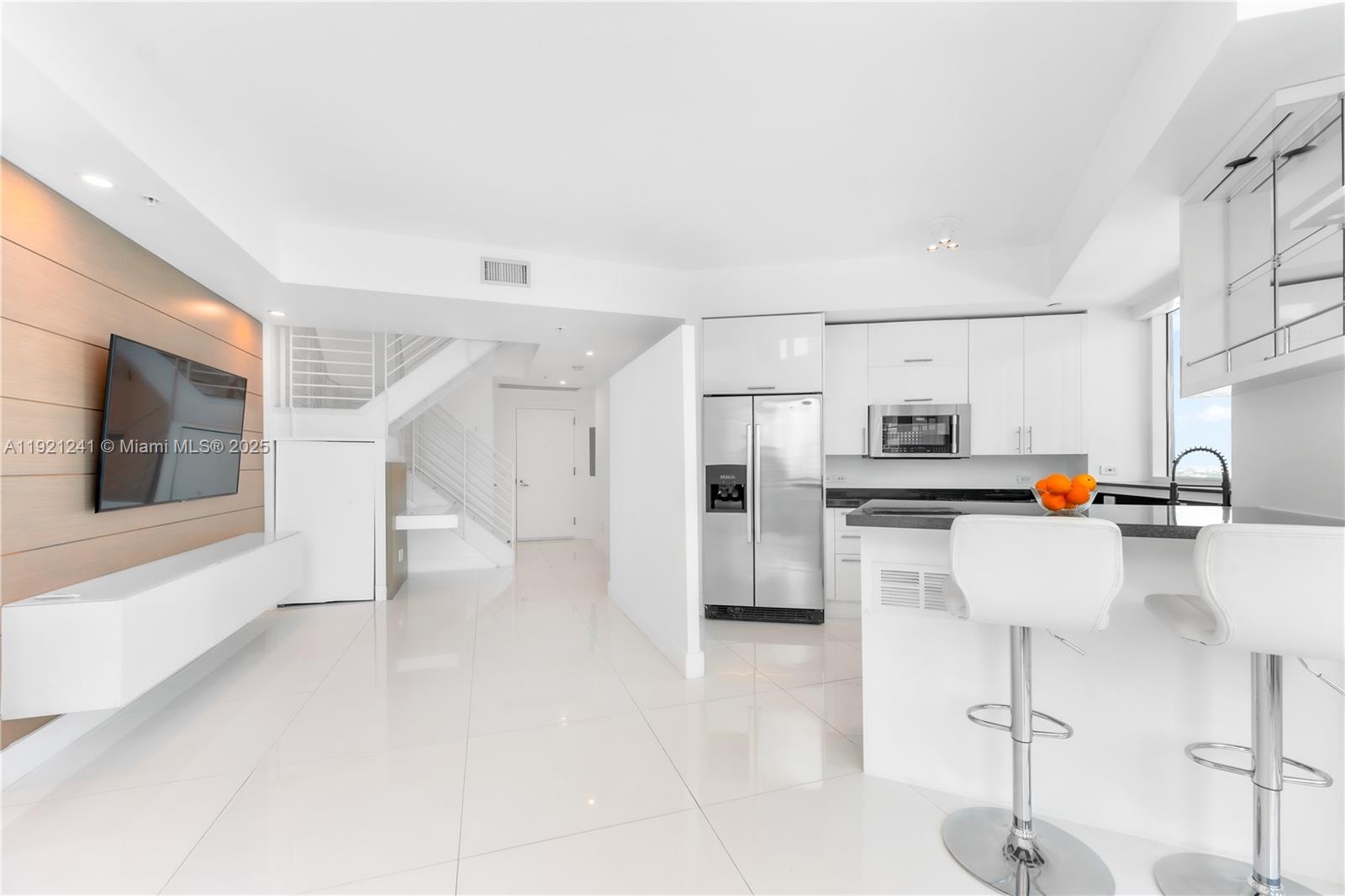 60 Southwest 13th Street, Unit 2626 Miami, FL 33130 - Photo 12 of 48 a view of kitchen with furniture and refrigerator