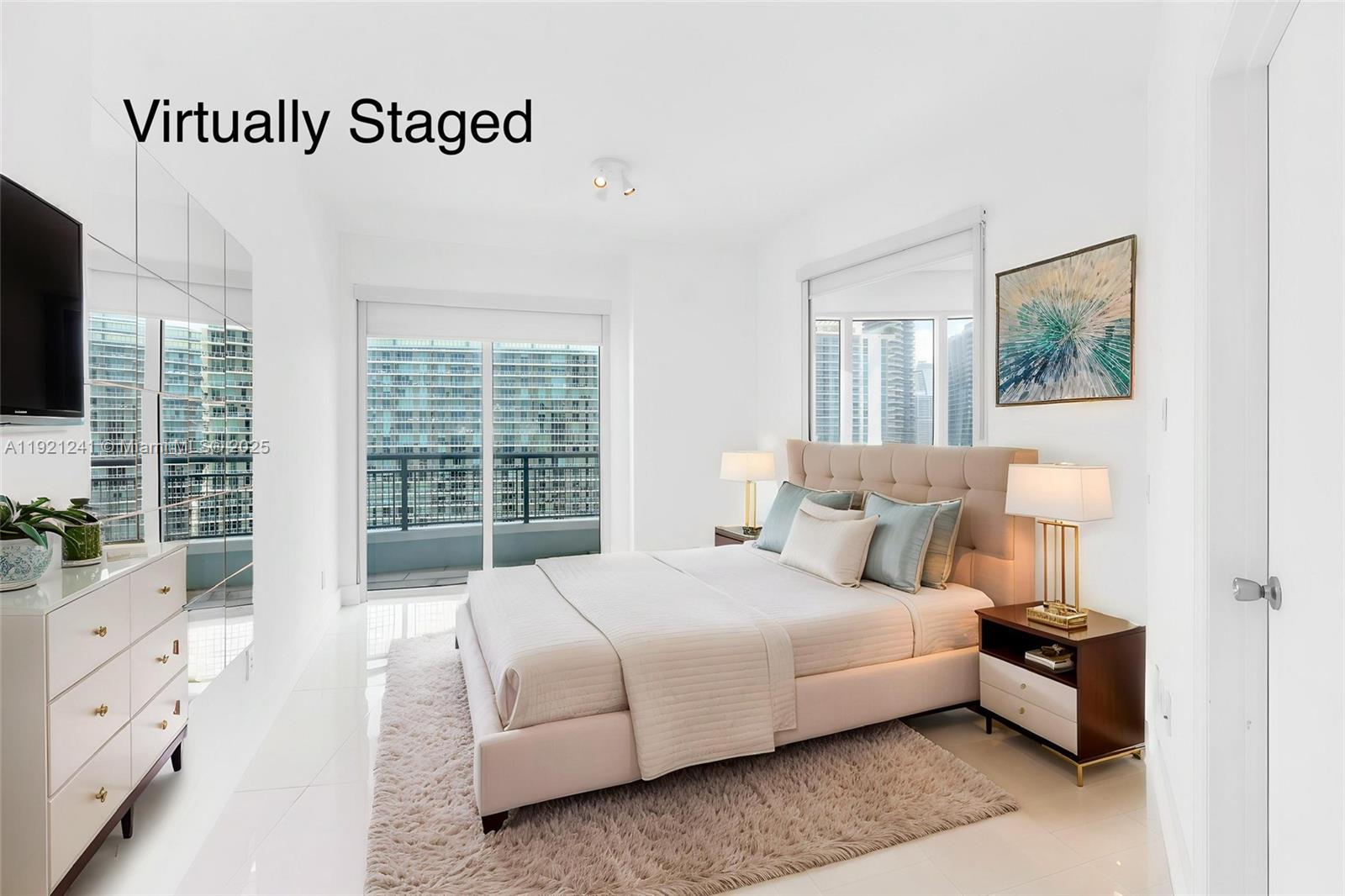 60 Southwest 13th Street, Unit 2626 Miami, FL 33130 - Photo 19 of 48 a spacious bedroom with a bed and a flat screen tv