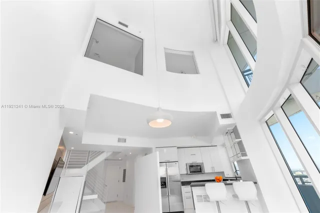 a living room with a flat screen tv and a couch