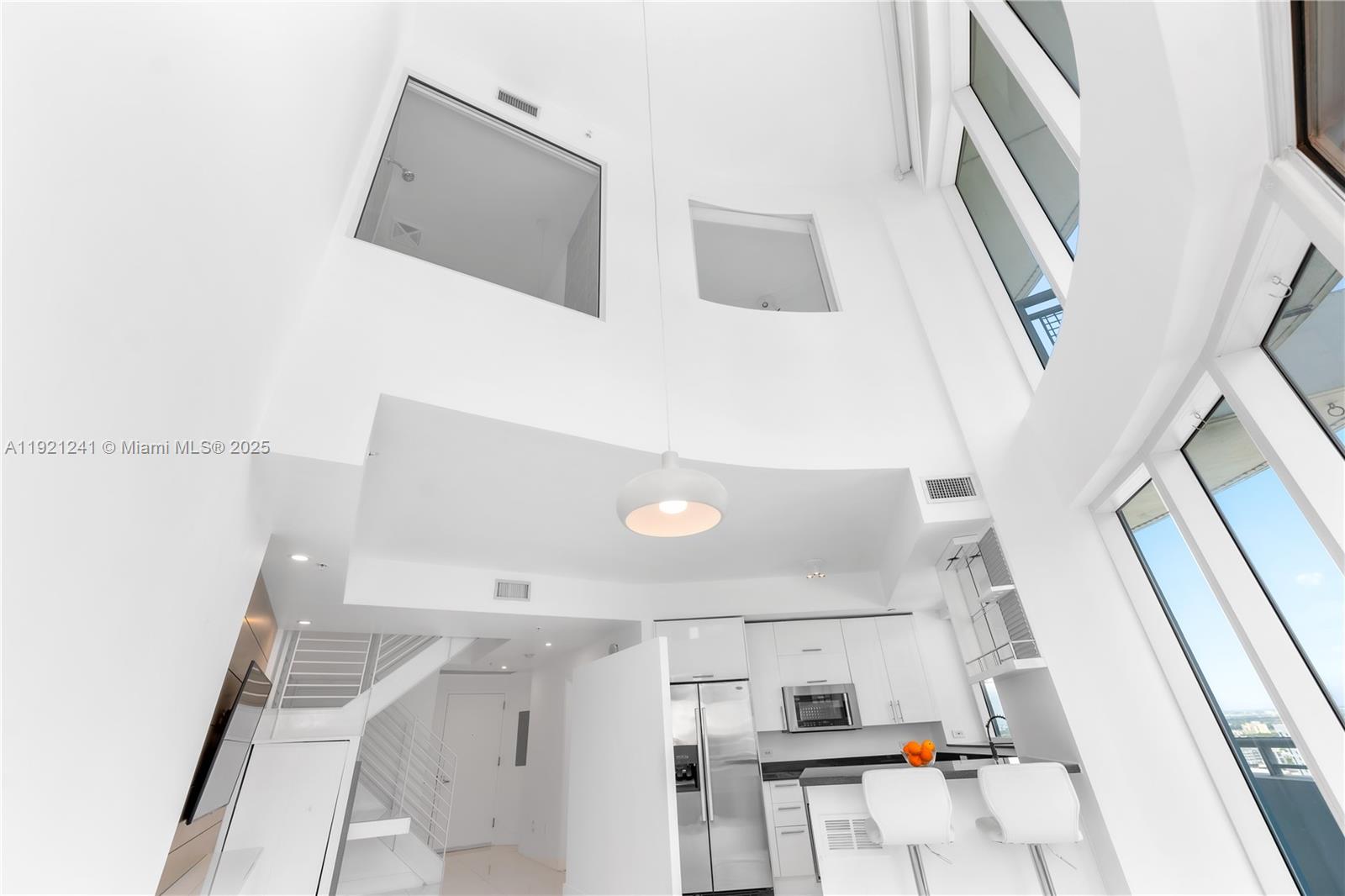 60 Southwest 13th Street, Unit 2626 Miami, FL 33130 - Photo 21 of 48 a view of living room with furniture and rug floor