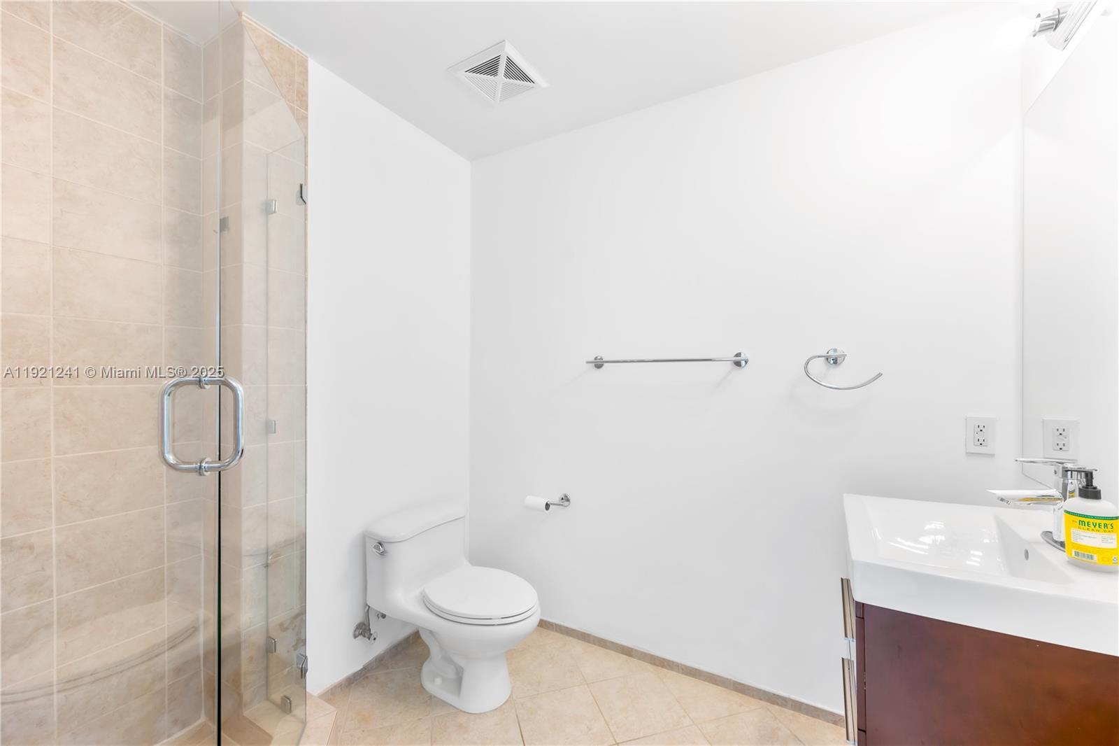 60 Southwest 13th Street, Unit 2626 Miami, FL 33130 - Photo 23 of 48 a bathroom with a sink a toilet and shower