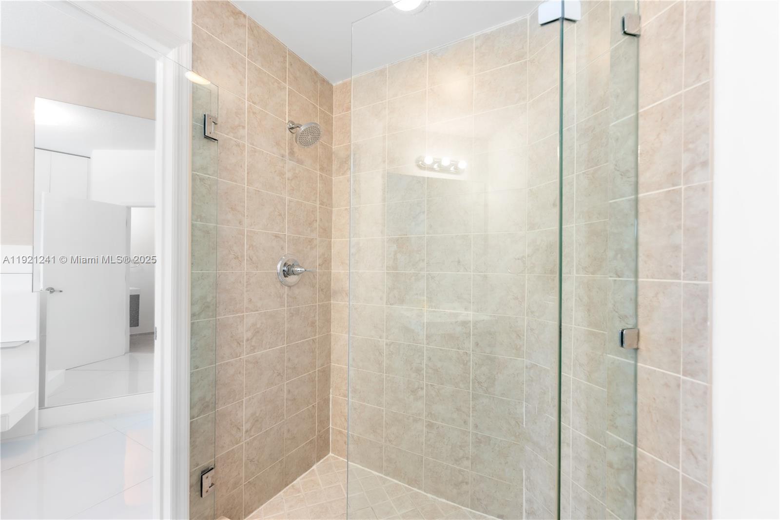 60 Southwest 13th Street, Unit 2626 Miami, FL 33130 - Photo 24 of 48 a bathroom with a shower and a glass door