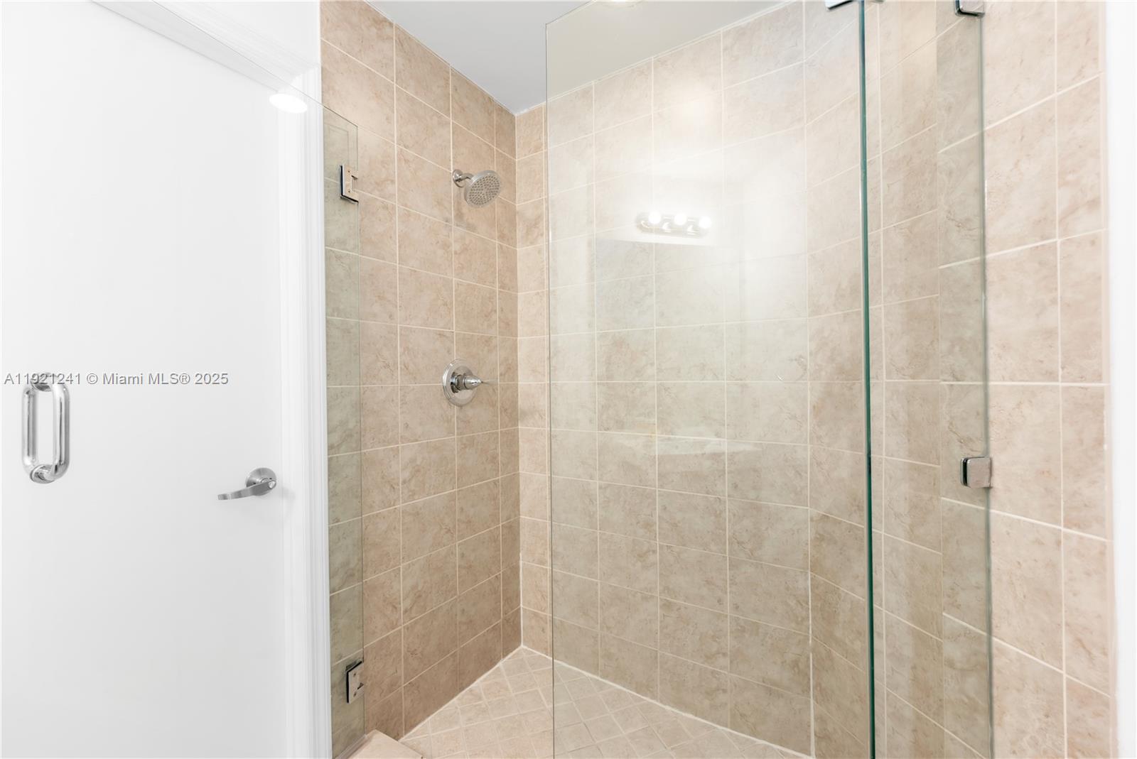 60 Southwest 13th Street, Unit 2626 Miami, FL 33130 - Photo 25 of 48 a bathroom with a shower