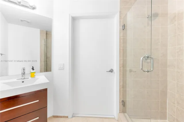 a view of walk in closet with white walls