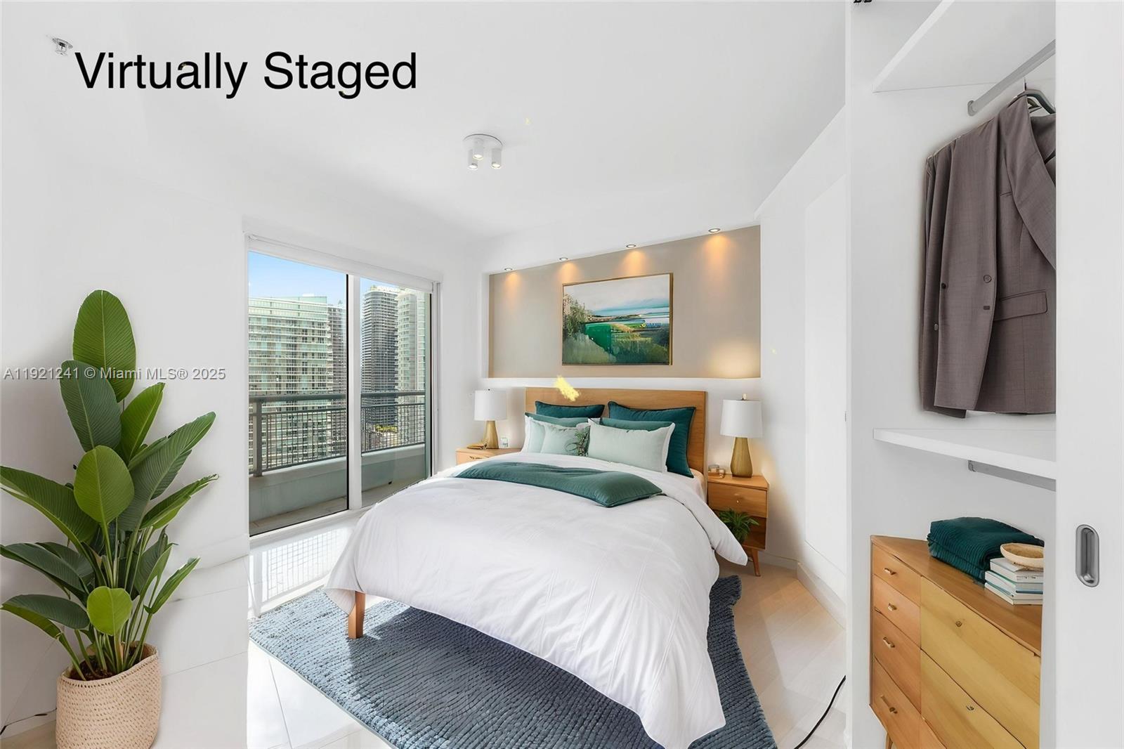 60 Southwest 13th Street, Unit 2626 Miami, FL 33130 - Photo 30 of 48 a bedroom with a bed a flat screen tv and a potted plant