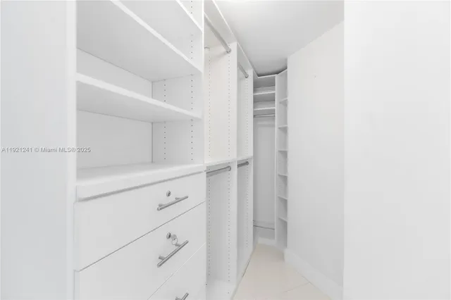 a bathroom with a sink mirror and vanity