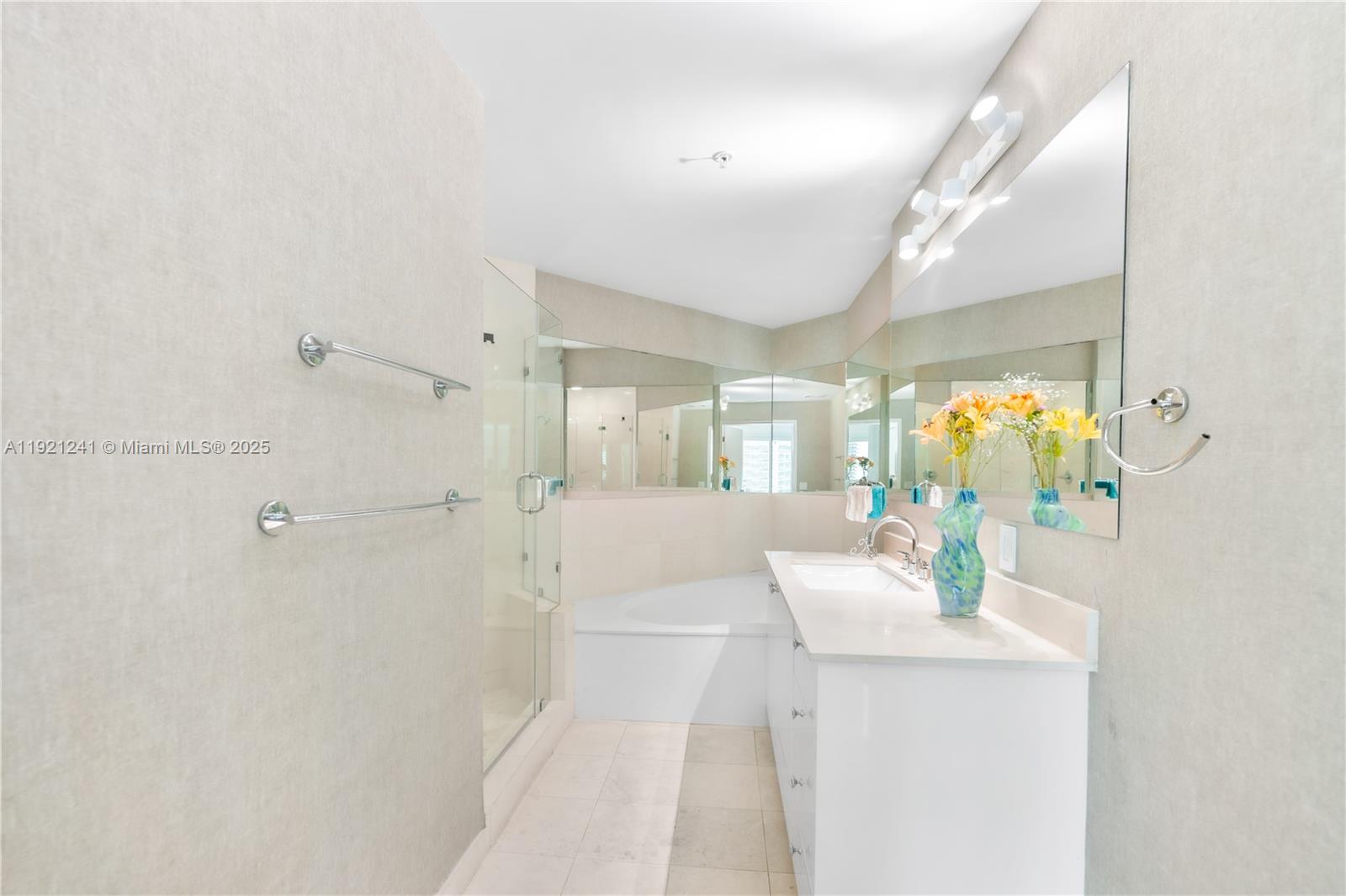 60 Southwest 13th Street, Unit 2626 Miami, FL 33130 - Photo 33 of 48 a bathroom with a sink mirror and vanity