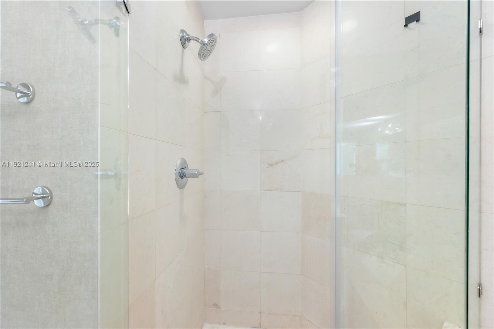 60 Southwest 13th Street, Unit 2626 Miami, FL 33130 - Photo 34 of 48 a bathroom with a shower