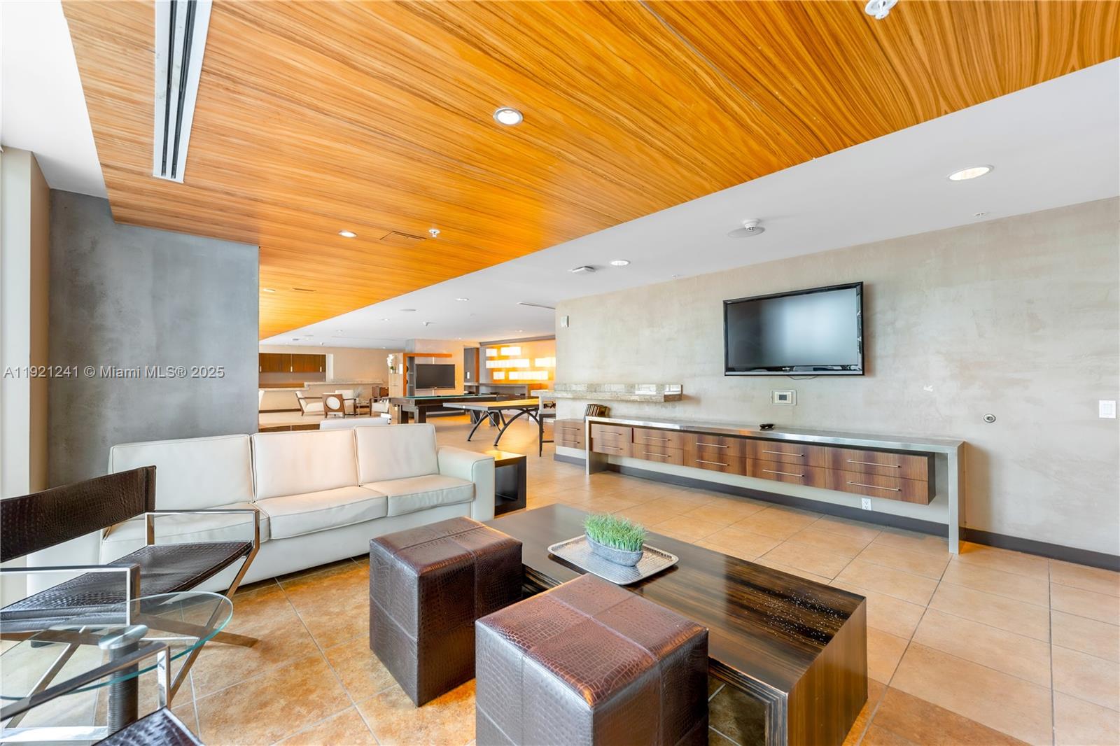 60 Southwest 13th Street, Unit 2626 Miami, FL 33130 - Photo 39 of 48 a living room with furniture and a flat screen tv