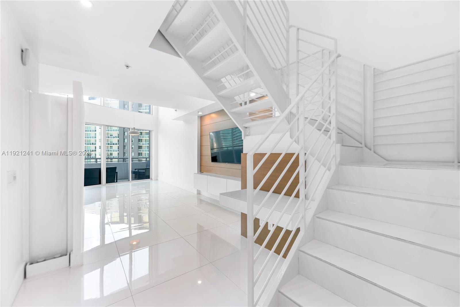 60 Southwest 13th Street, Unit 2626 Miami, FL 33130 - Photo 4 of 48 a view of an entryway with wooden floor