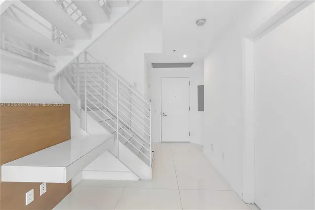 a view of entryway with white walls