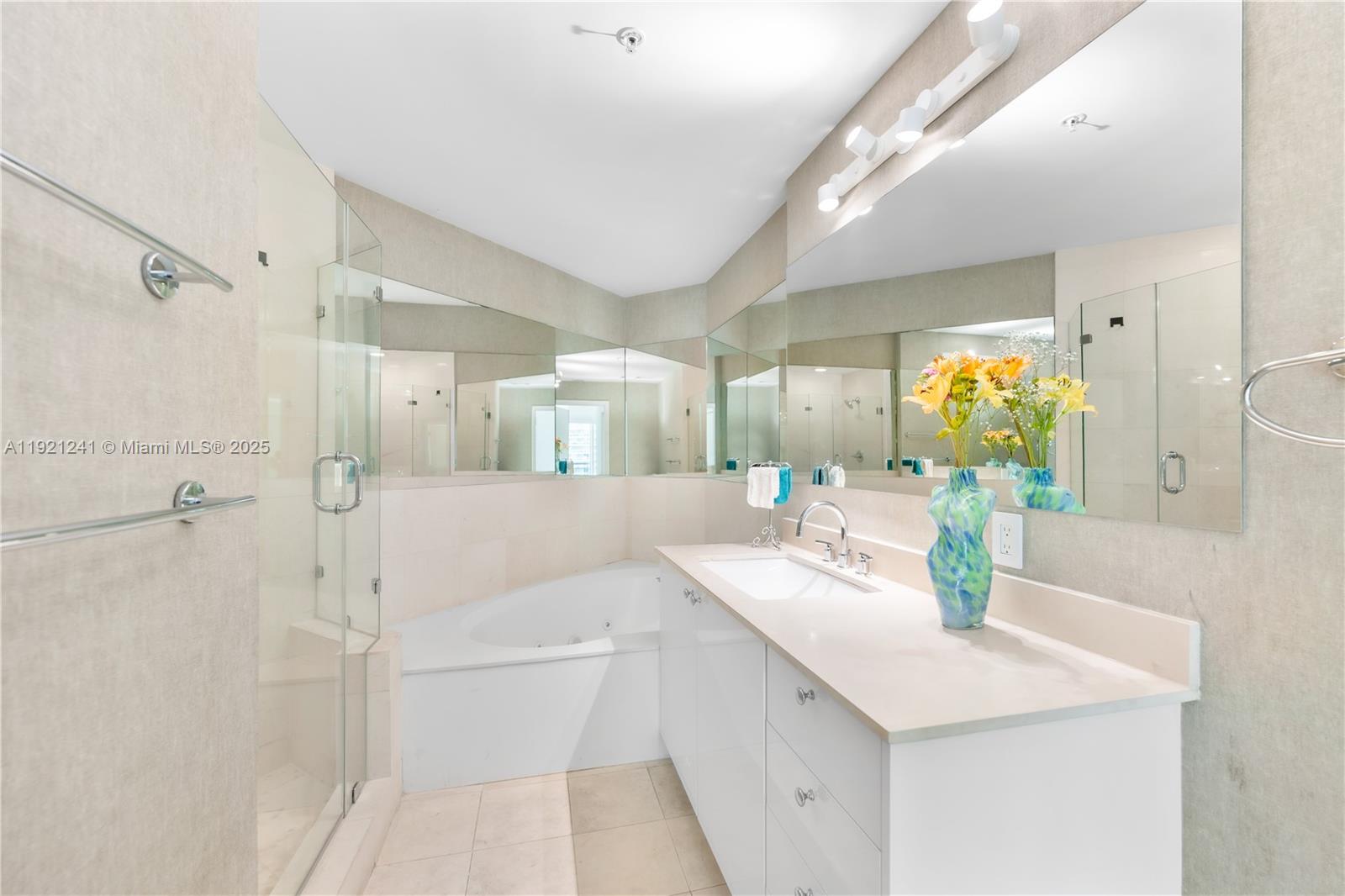 60 Southwest 13th Street, Unit 2626 Miami, FL 33130 - Photo 10 of 48 a bathroom with a double vanity sink mirror and shower