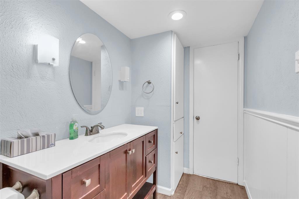 4688 Matilda Street, Unit H Dallas, TX 75206 - Photo 19 of 20 a bathroom with a double vanity sink and a mirror