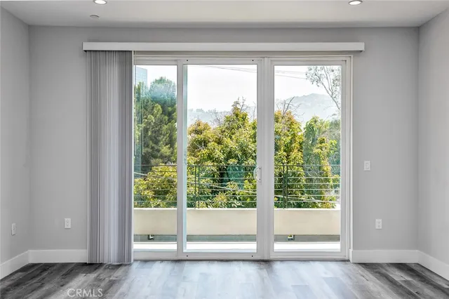 a view of an empty room and window