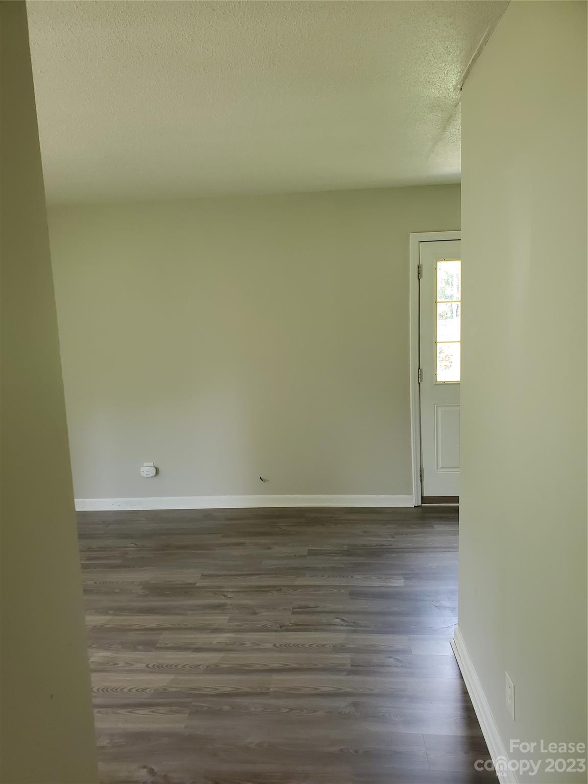 216 Lakeside Avenue Davidson, NC 28036 - Photo 6 of 6 a view of an empty room and window