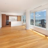 a large room with a large window and a balcony