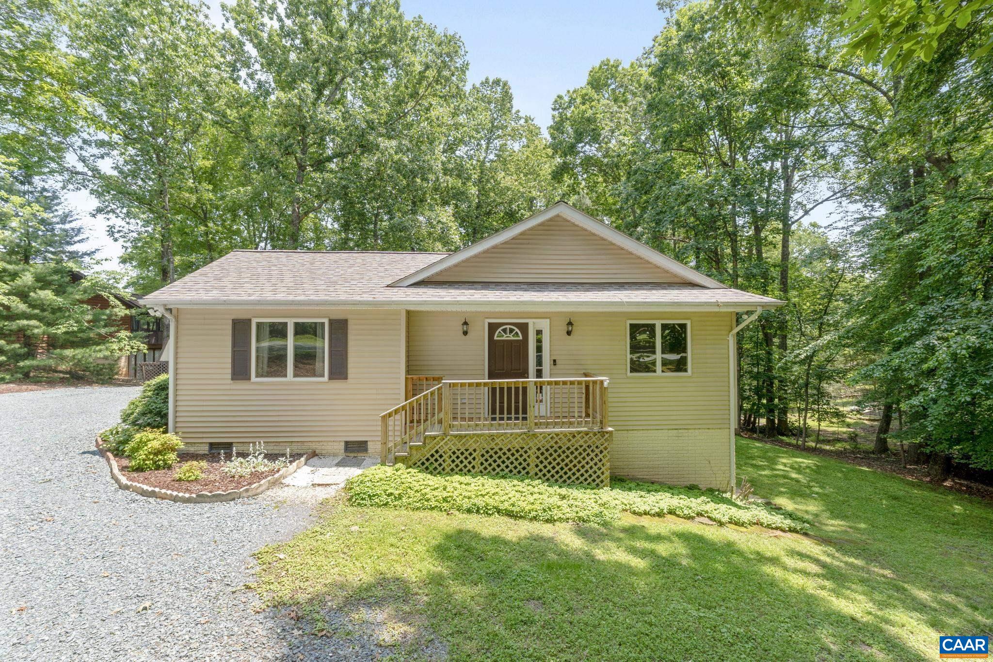 7 Sand Trap Terrace Palmyra, VA 22963 - Photo 1 of 27 a front view of a house with a yard