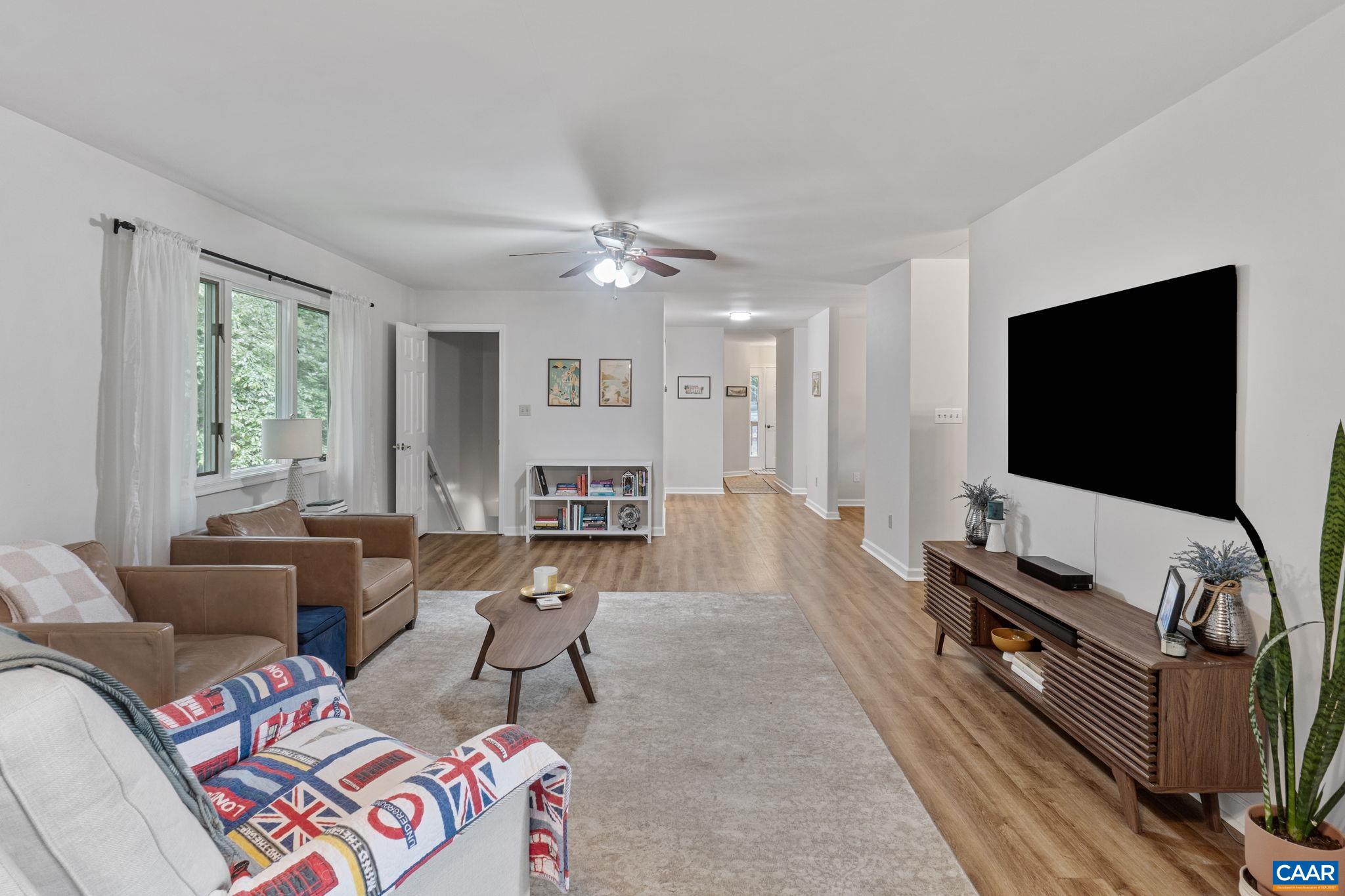 7 Sand Trap Terrace Palmyra, VA 22963 - Photo 13 of 27 a living room with furniture and a flat screen tv