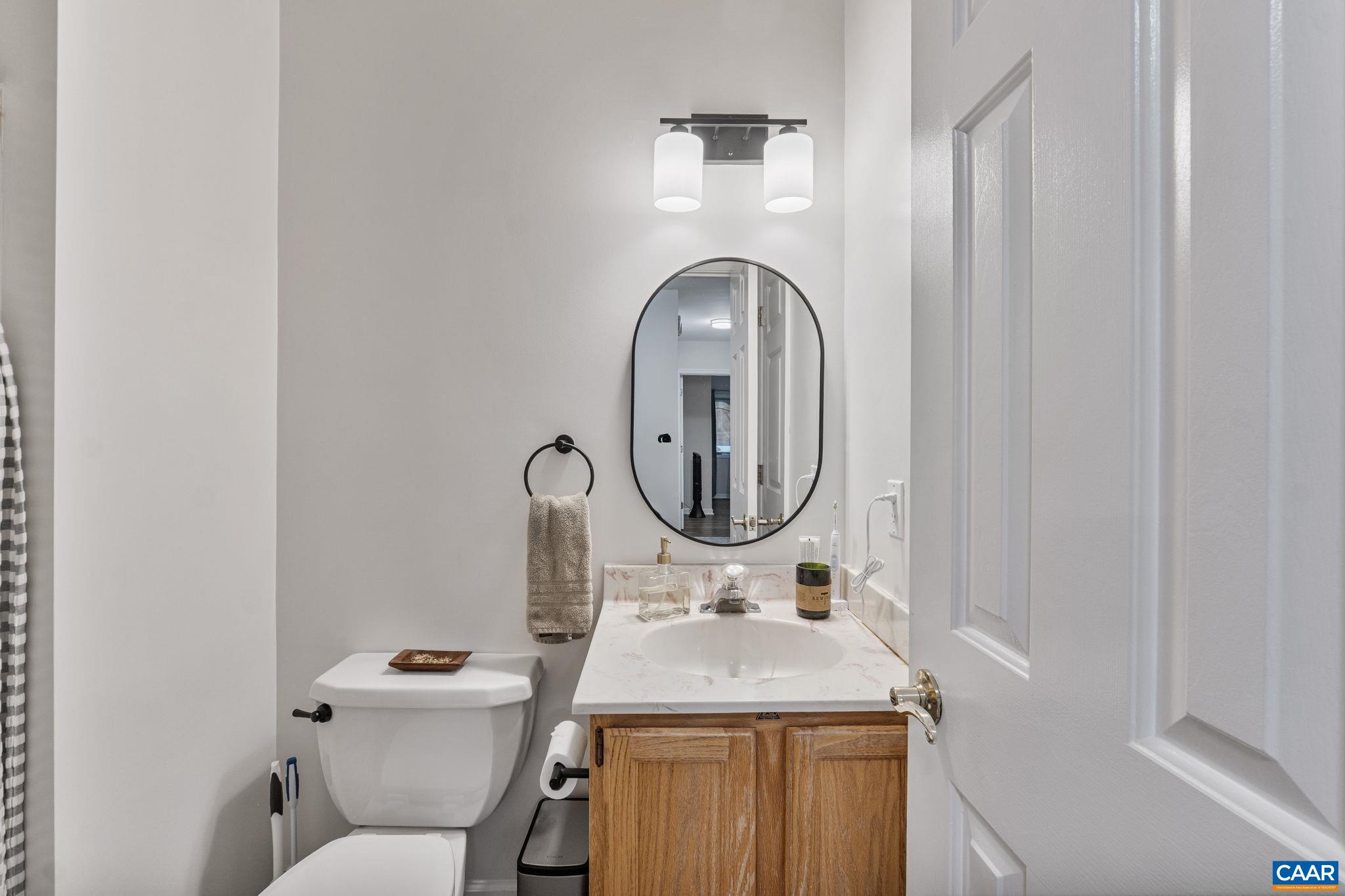 7 Sand Trap Terrace Palmyra, VA 22963 - Photo 22 of 27 a bathroom with a sink and a toilet