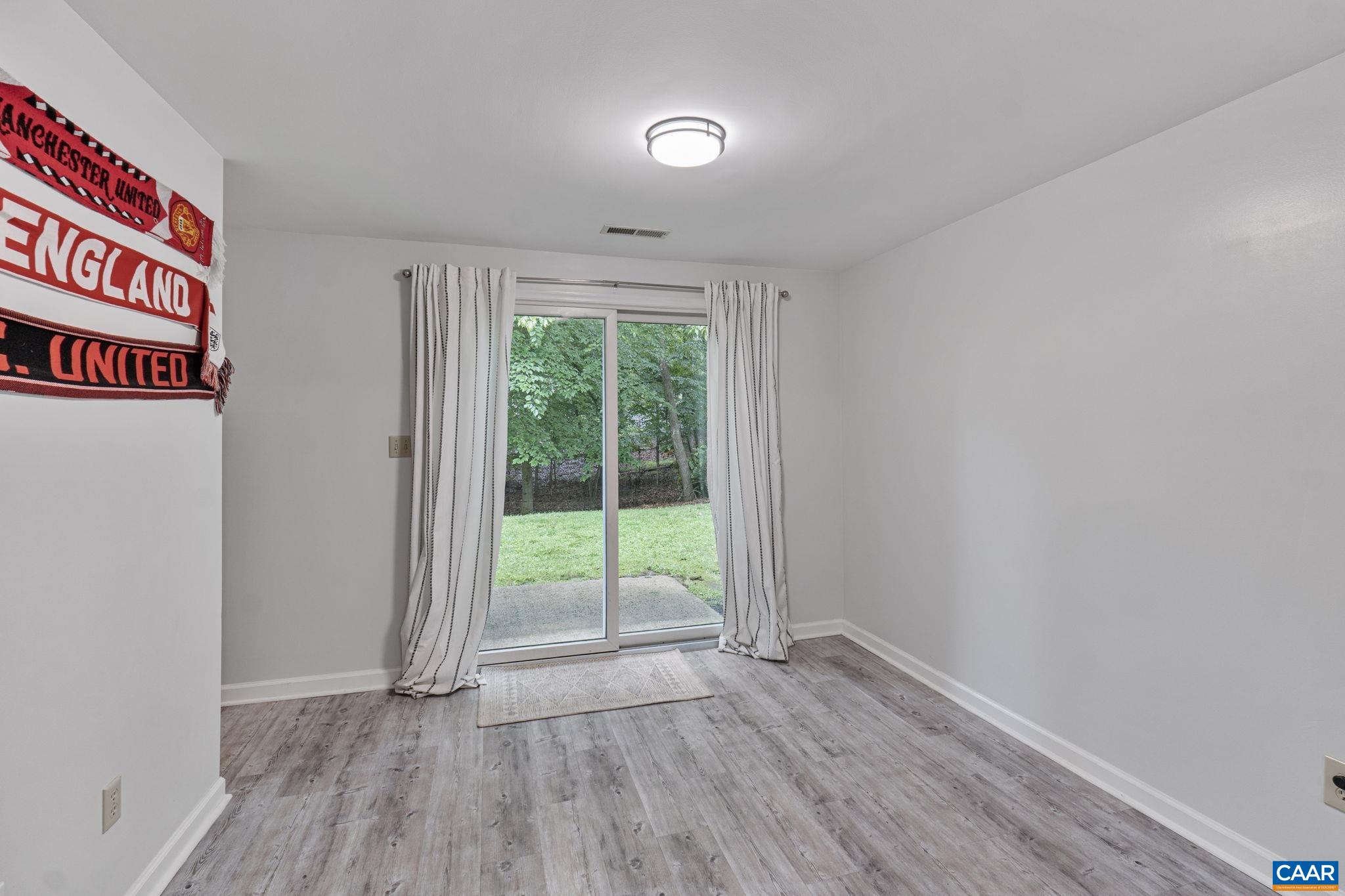 7 Sand Trap Terrace Palmyra, VA 22963 - Photo 24 of 27 a view of an empty room with wooden floor and a window