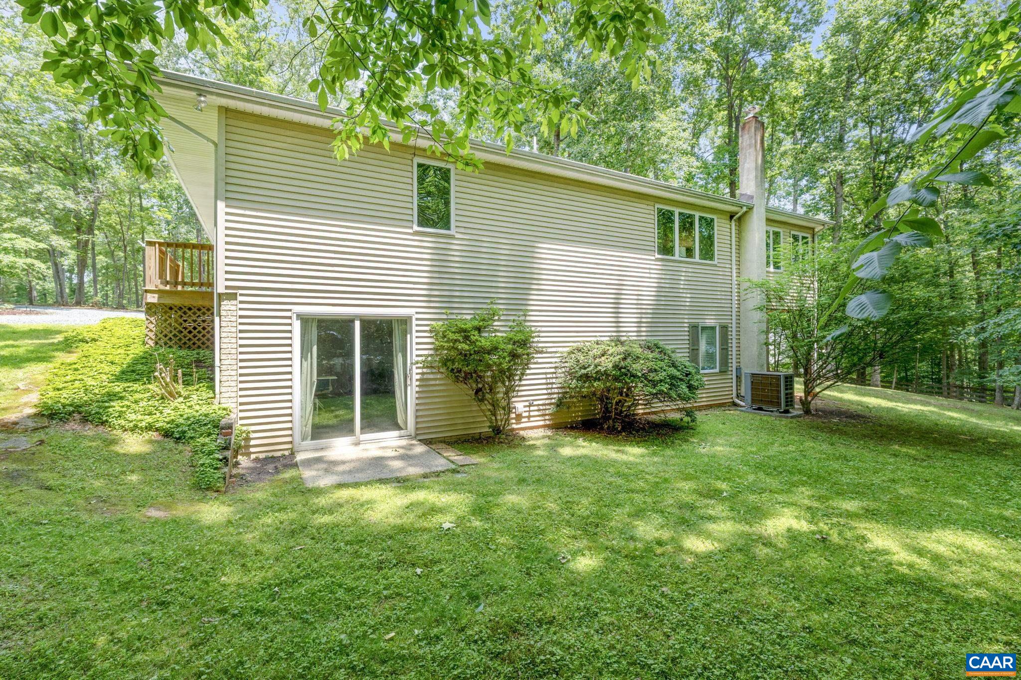 7 Sand Trap Terrace Palmyra, VA 22963 - Photo 7 of 27 a view of a house with a backyard