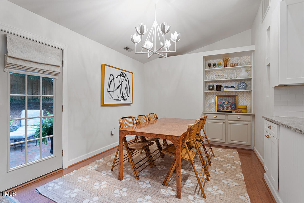 2718 Ashland Street Raleigh, NC 27608 - Photo 12 of 25 a dining room with a table and chairs