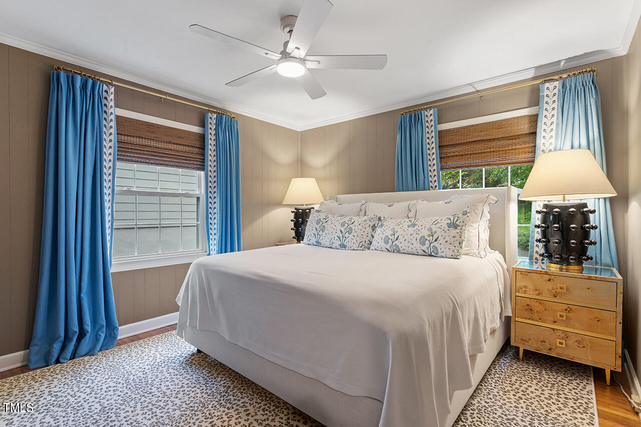 2718 Ashland Street Raleigh, NC 27608 - Photo 16 of 25 a bedroom with a bed and a window