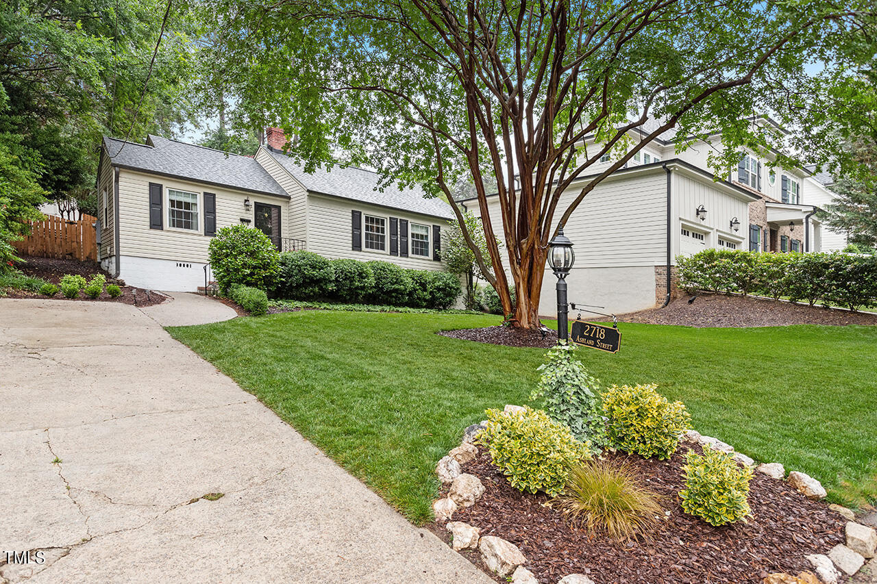 2718 Ashland Street Raleigh, NC 27608 - Photo 25 of 25 a front view of a house with a yard and green space