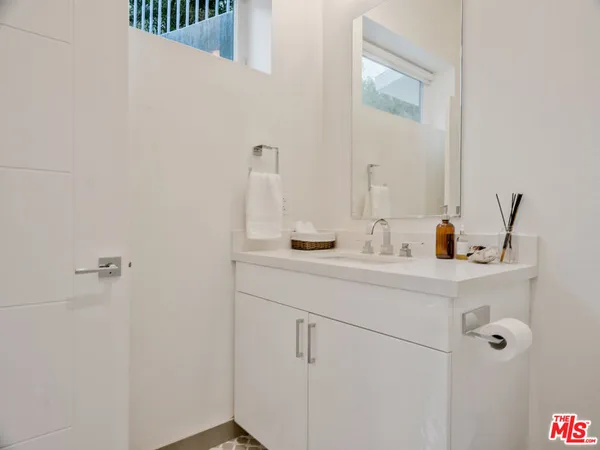 a bathroom with a sink and mirror