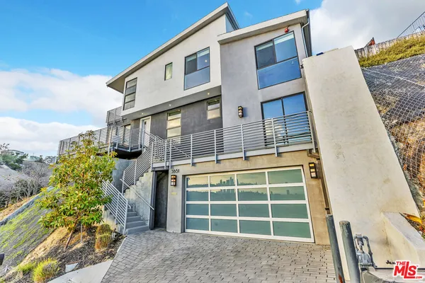 a front view of a house with a large window