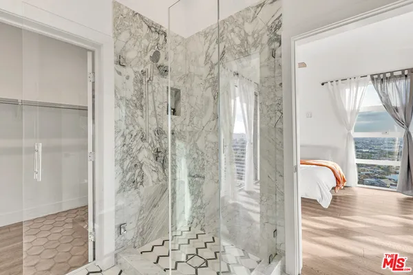 a bathroom with a shower and a toilet