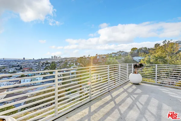 a view of a balcony with city view