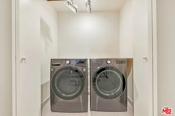 a view of a balcony with wooden floor and fence