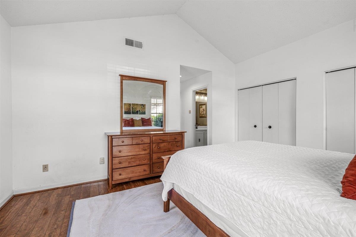2976 Kin Cove, Unit 2976 Memphis, TN 38119 - Photo 19 of 24 Bedroom featuring a vaulted ceiling and wood-finish flooring