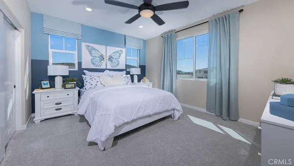 a bed room with a bed and a chandelier