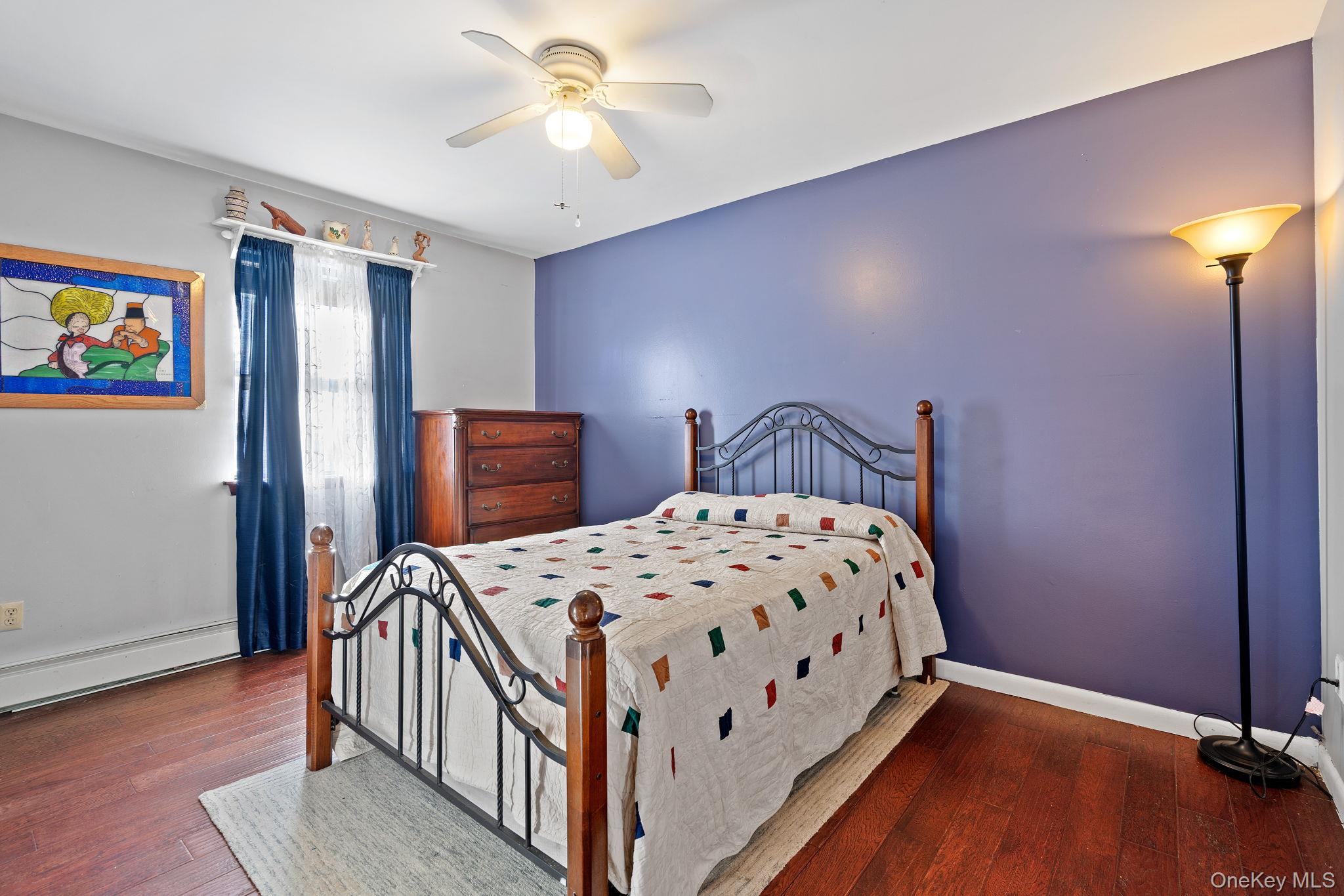 171 E Road Wallkill, NY 12589 - Photo 16 of 47 Bedroom featuring dark wood-type flooring and a ceiling fan