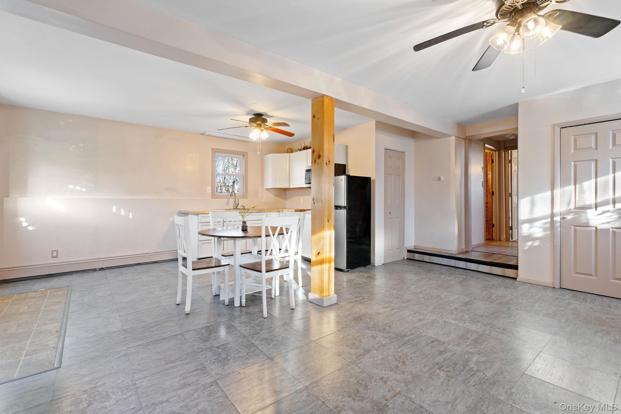 171 E Road Wallkill, NY 12589 - Photo 20 of 47 Dining room featuring ceiling fan and a baseboard heating unit