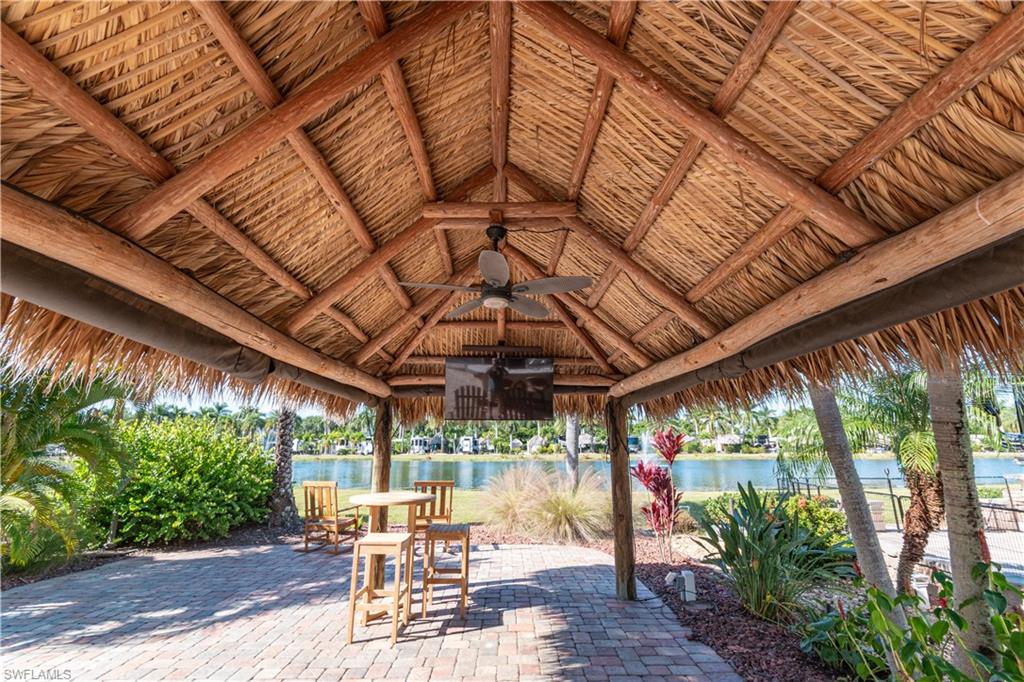 5216 Pineland Daisy Trail Fort Myers, FL 33905 - Photo 11 of 16 View of patio / terrace featuring ceiling fan and a water view